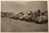 Grant and Lee tanks at a repair depot in Italy or North Africa.jpg