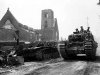 3 August 1944 - Churchill with Royal Scots Fusiliers pass a destroyed Panzer IV in Le Tourneur.jpg