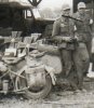 2 Austrian Medics with gravemarkers           Chouat German military hospital Tunisia 1943.jpg