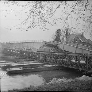 Sherman tank of the 1st Coldstream Guards, crossing a pontoon bridge over the Dortmund-Ems Canal, 6 April 1945; IWM BU 3158