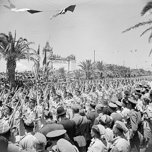 Scots Guards march past during the Victory Parade in Tunis; IWM NA 3016