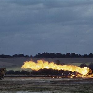 Churchill tank fitted with a Crocodile flamethrower in action, August 1944; IWM TR 2310