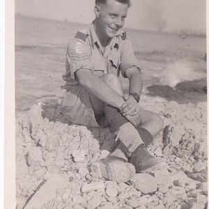 Granddad with burning oil tanker in background