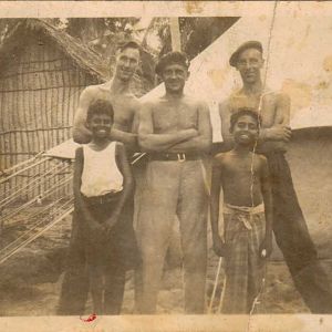 With unknown mates. A Commando beret?