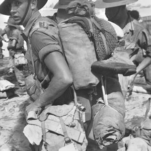 AITAPE BEACH, NEW GUINEA. 1944-11-26 MOVING ASHORE FROM A LANDING BARGE.